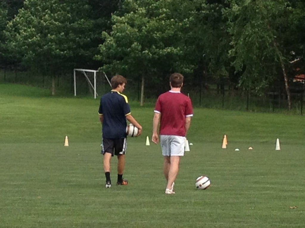 brothers playing soccer, practicing soccer, 