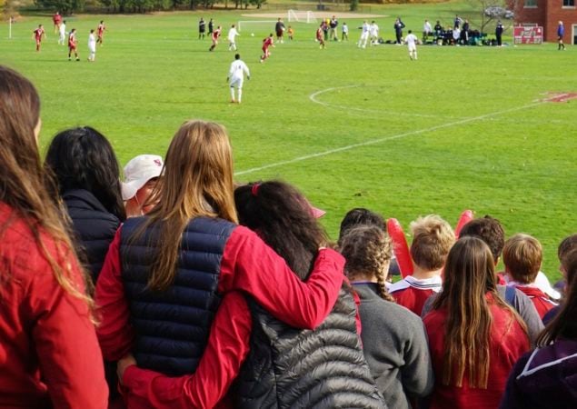 teens watching a football game 