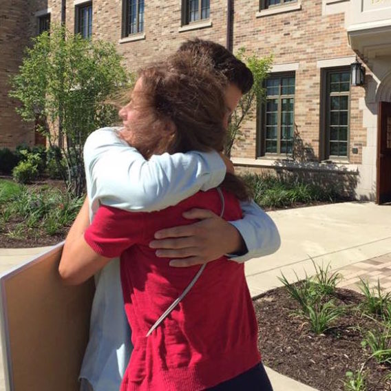 mom and son hugging on move in day
