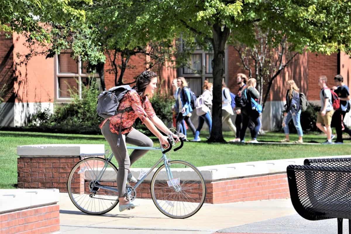 college student riding a bike 