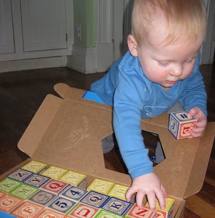 baby playing with blocks 