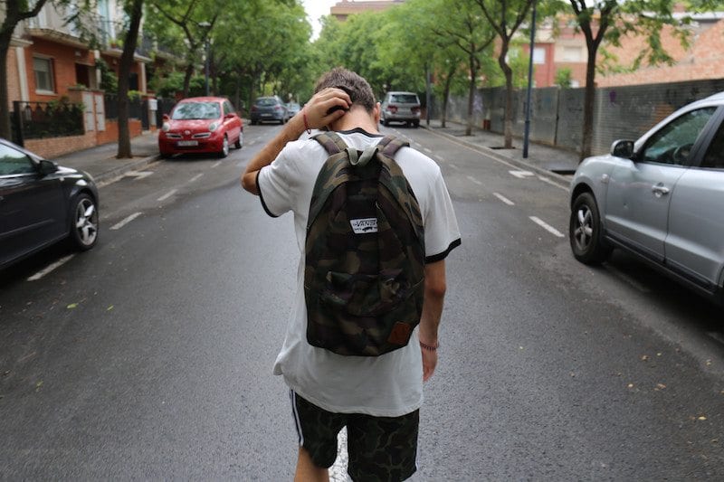 teen boy wearing backpack 