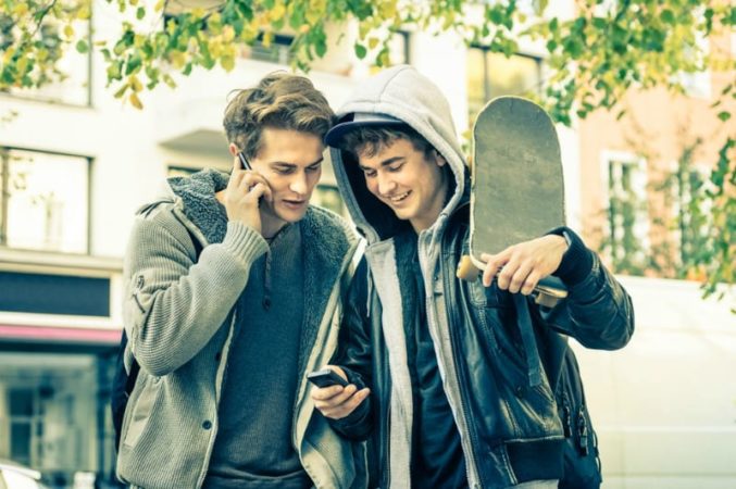 two teen boys with skateboards