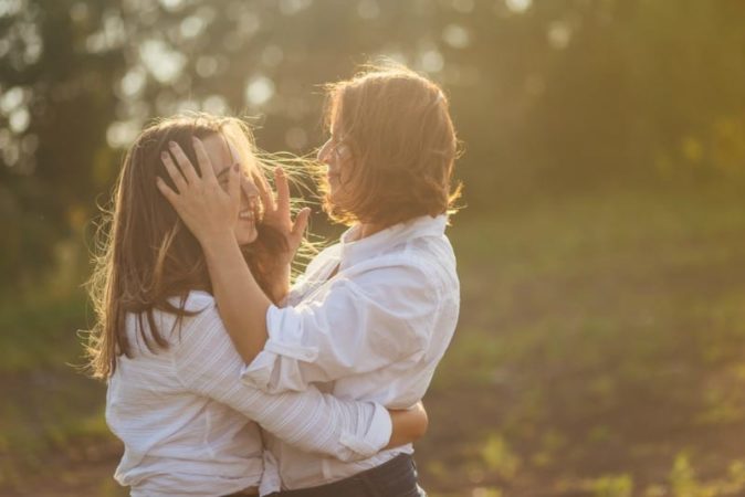 teen and mom hugging 