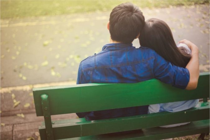 couple on park bench 