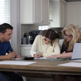 Family looking at information about college admissions and paying for college