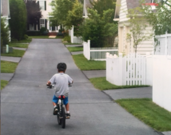 child biking away