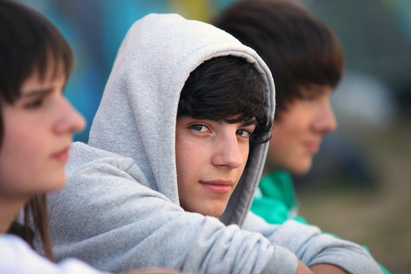 teenage boy with dark brown hair