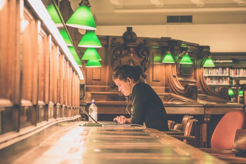 student in library