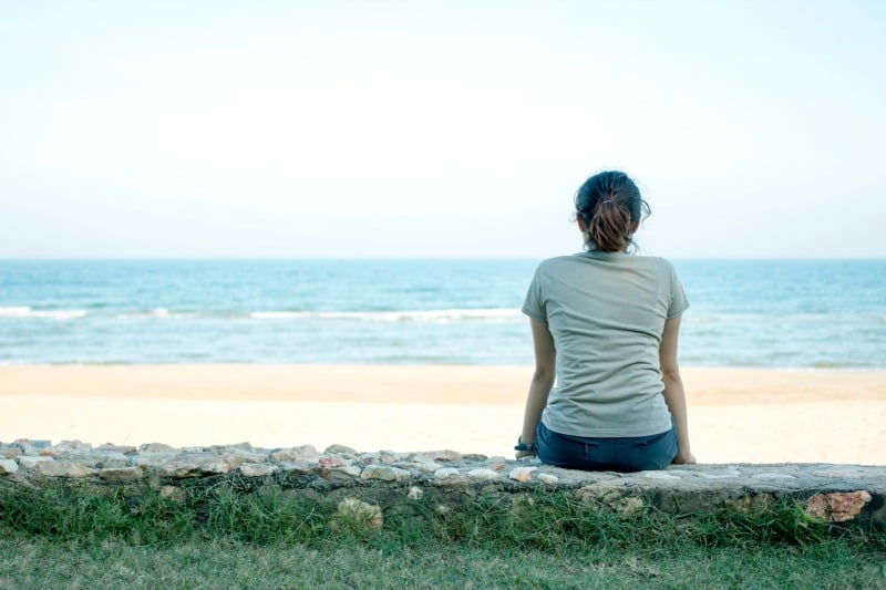 Woman sitting at beach