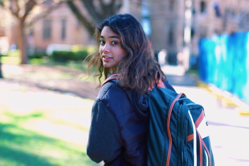 college woman with backpack