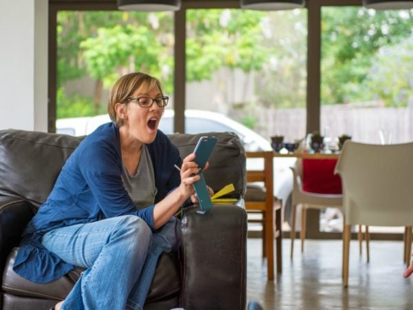 woman reading text on phone 