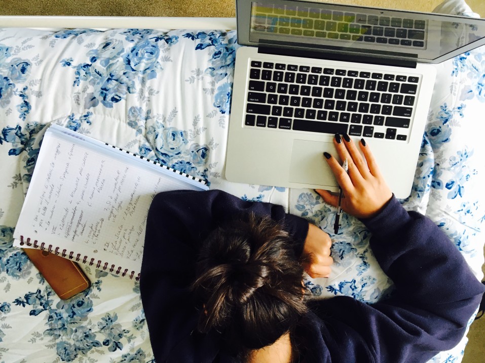 girl studying in bed