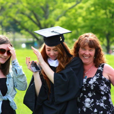 graduate with family
