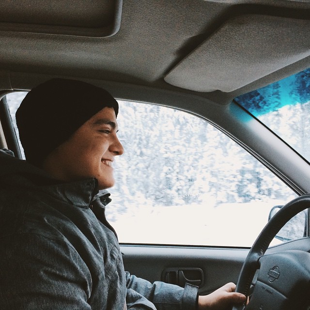 college boy driving in winter 