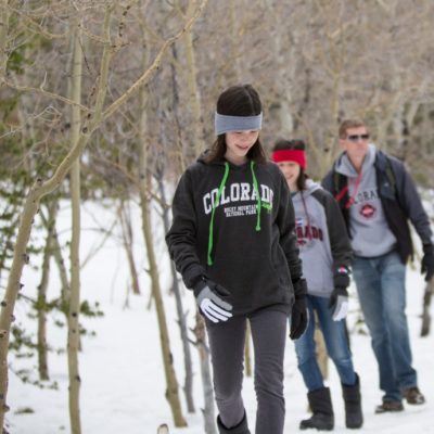 family walking snow