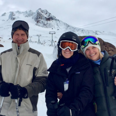 family skiing together