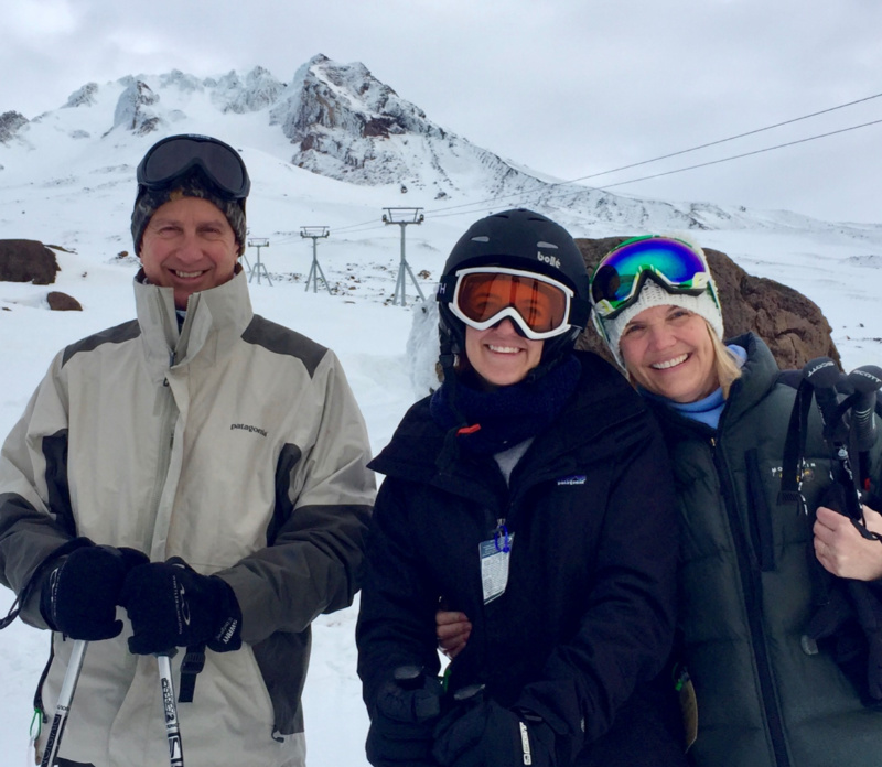 family skiing together