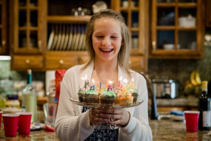 teen girl with birthday cupcakes 