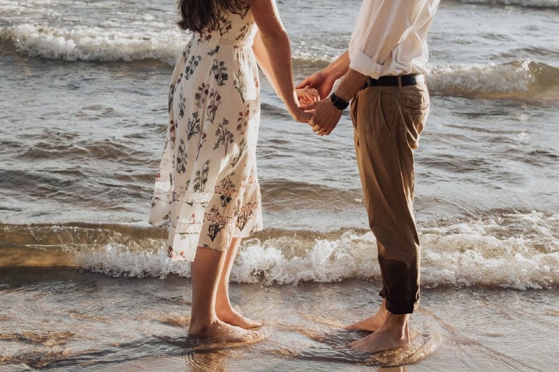 young couple holding hands