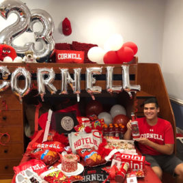 bed decorated in Cornell colors