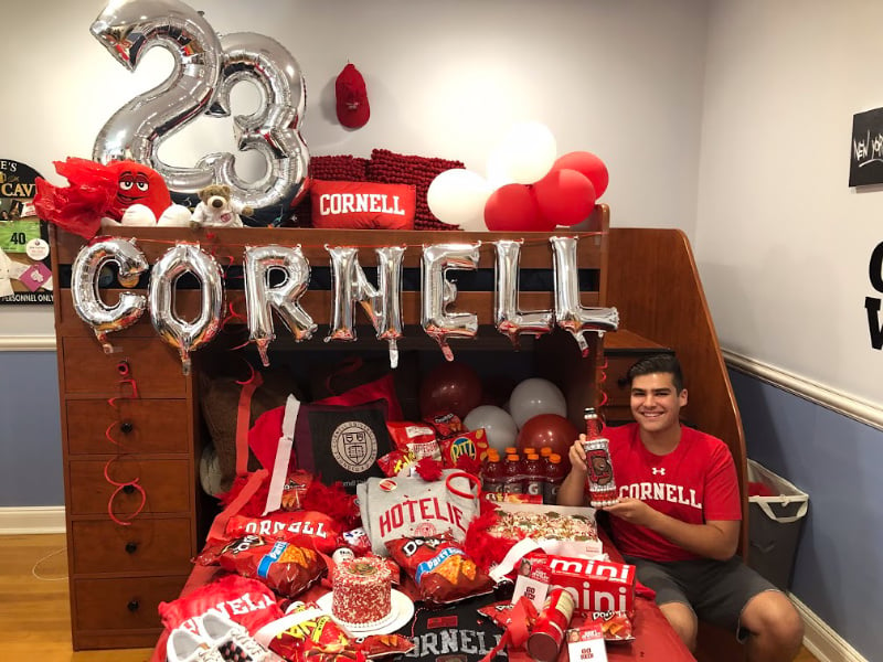 bed decorated in Cornell colors