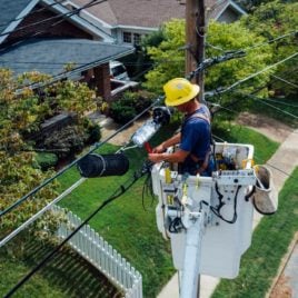 man working on telephone lines