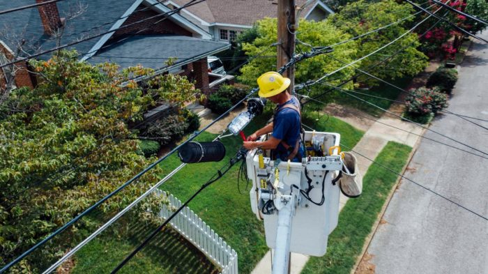 man working on telephone lines 