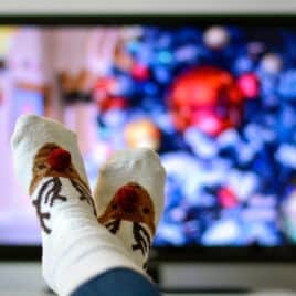 fuzzy socks watching Christmas TV