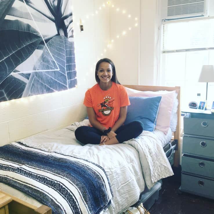 college student on her dorm bed
