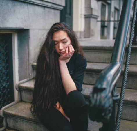 woman sitting on step