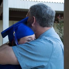 dad hugging grad