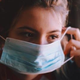 teen girl wearing a mask