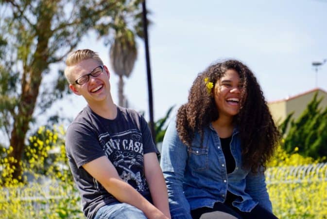 two teens laughing