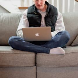 teen boy with laptop at home