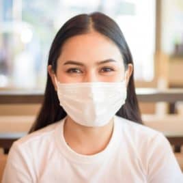 teen girl wearing face mask
