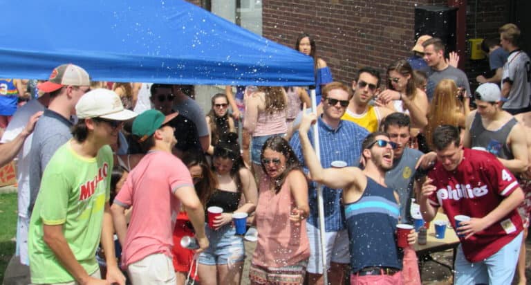 students drinking at outdoor college party