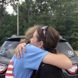 daughter hugging mom