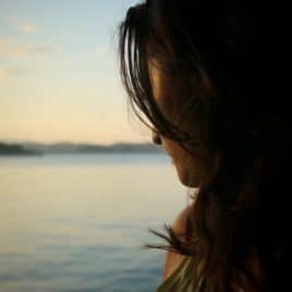 woman at lake, pensive