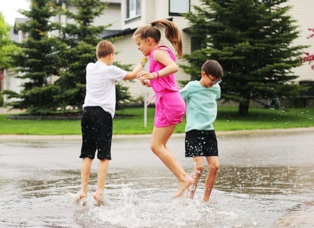 tweens jumping in puddles 
