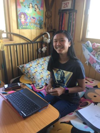 teen using a rolling desk 