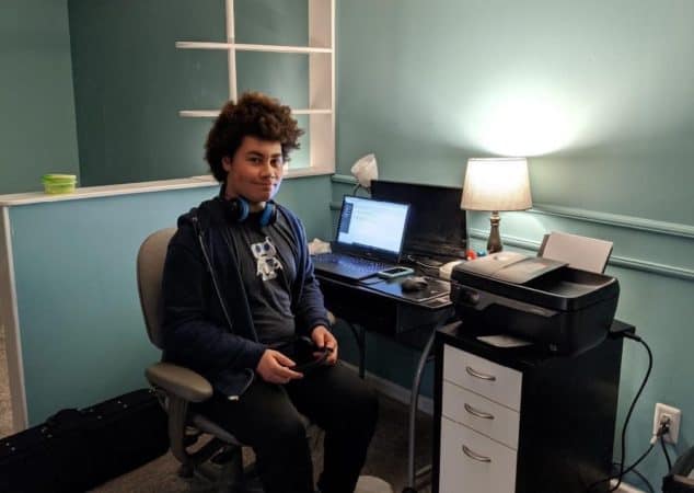 teen boy in home study space