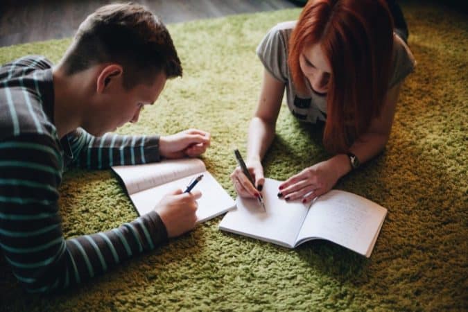 boy and girl doing homework together