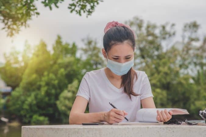 Girl studying with mask
