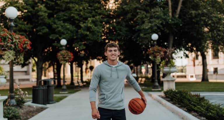 high school boy playing basketball