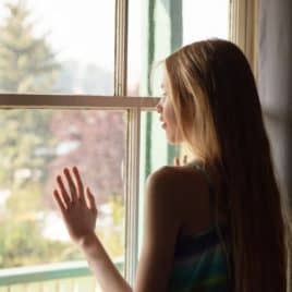 teen girl at window