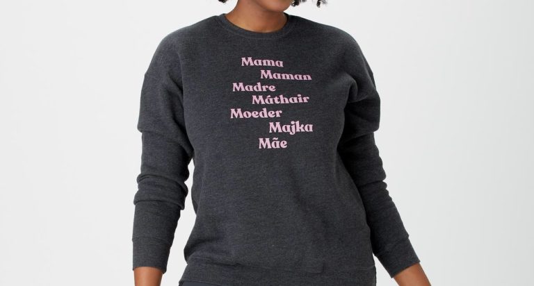 Black woman wearing sweater with words for mom