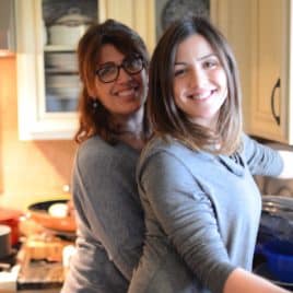 mom and adult daughter in kitchen