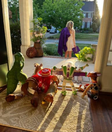 Girl saying goodbye to Toy Story toys