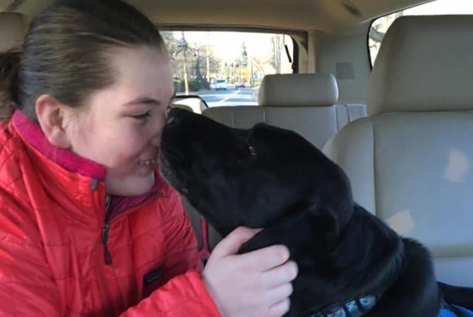 autistic girl with therapy dog